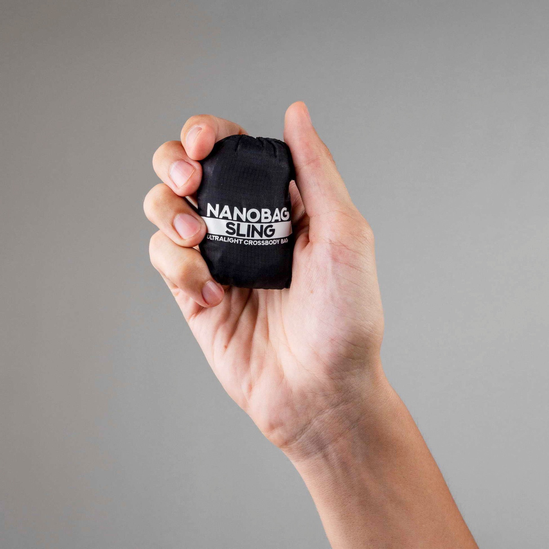 Nanobag Ultra-Lightweight Foldable Sling for Women & Men, Reusable Grocery & Travel Bag, Packable Collapsible Compact Market Crossbody - Sling Black