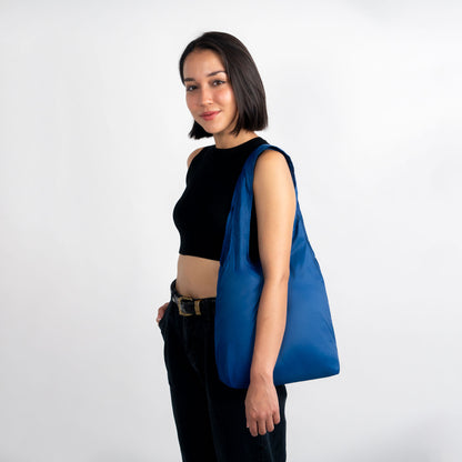 Woman with blue micro foldable nanobag